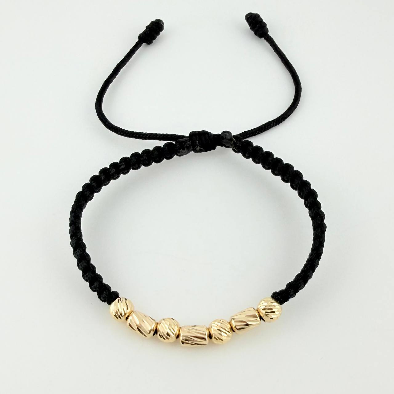 Black Woven Bracelet with Alternating Cylinders and Diamond Cut Beads in 18K Yellow Gold
