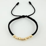 Black Woven Bracelet with Alternating Cylinders and Diamond Cut Beads in 18K Yellow Gold