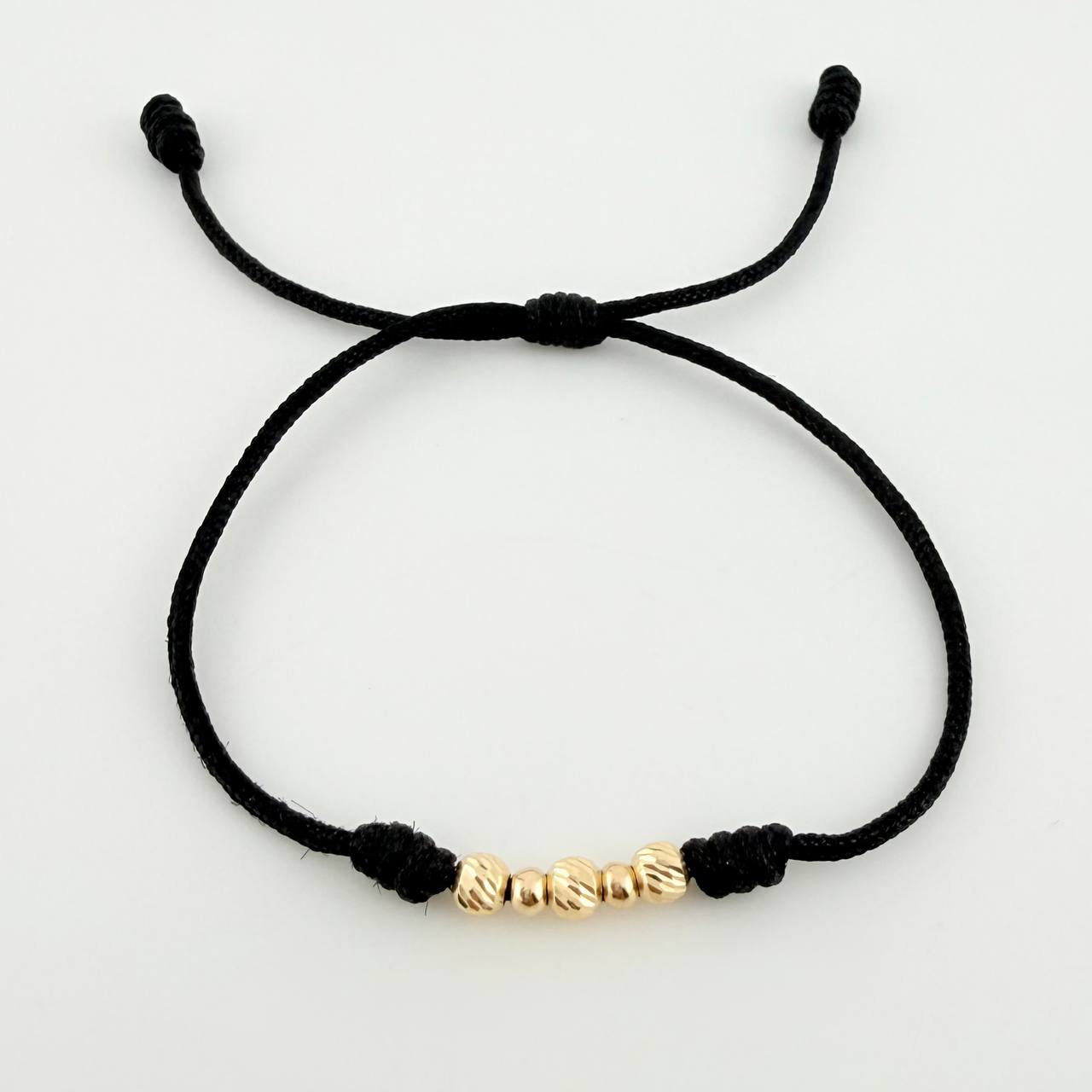 Pulsera Tejida Negra Bolas Diamantadas/ Lisas Oro Amarillo 18K