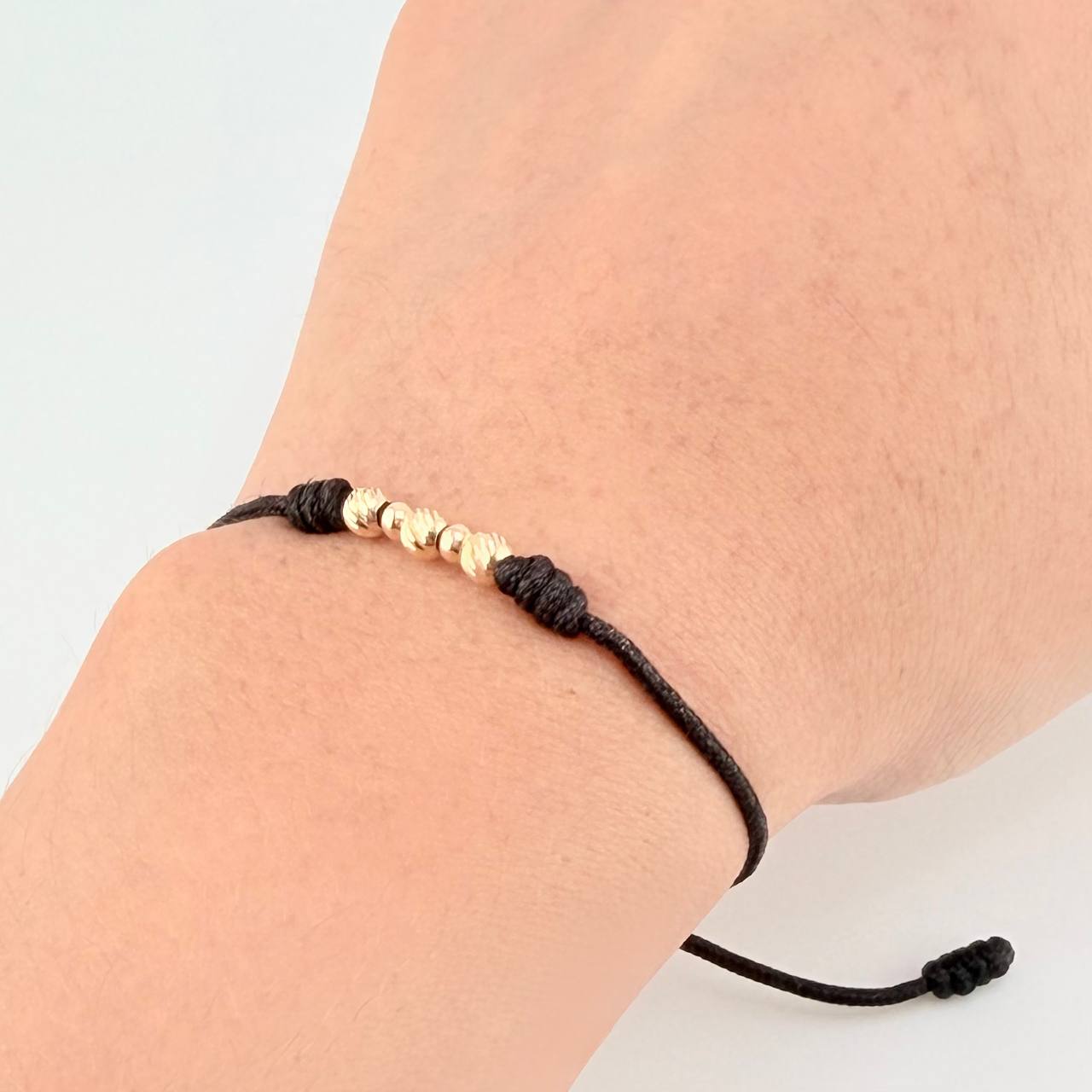 Pulsera Tejida Negra Bolas Diamantadas/ Lisas Oro Amarillo 18K