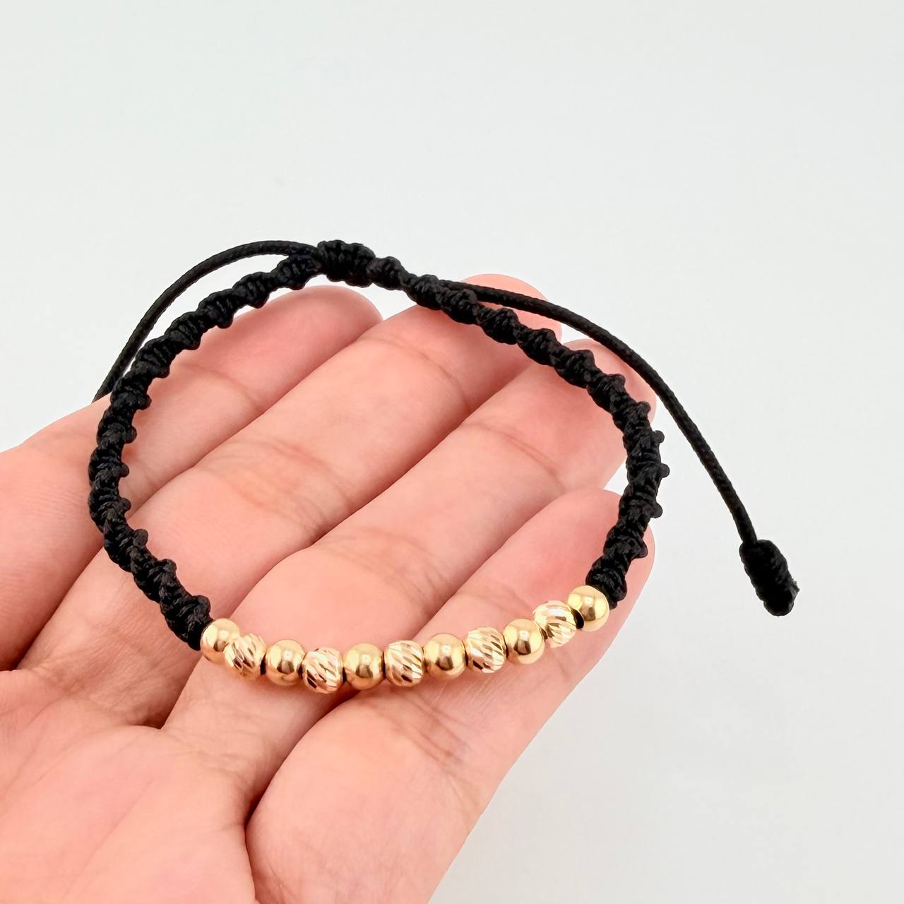 Black Woven Bracelet with Diamond Cut/Plain Beads in 18K Yellow Gold