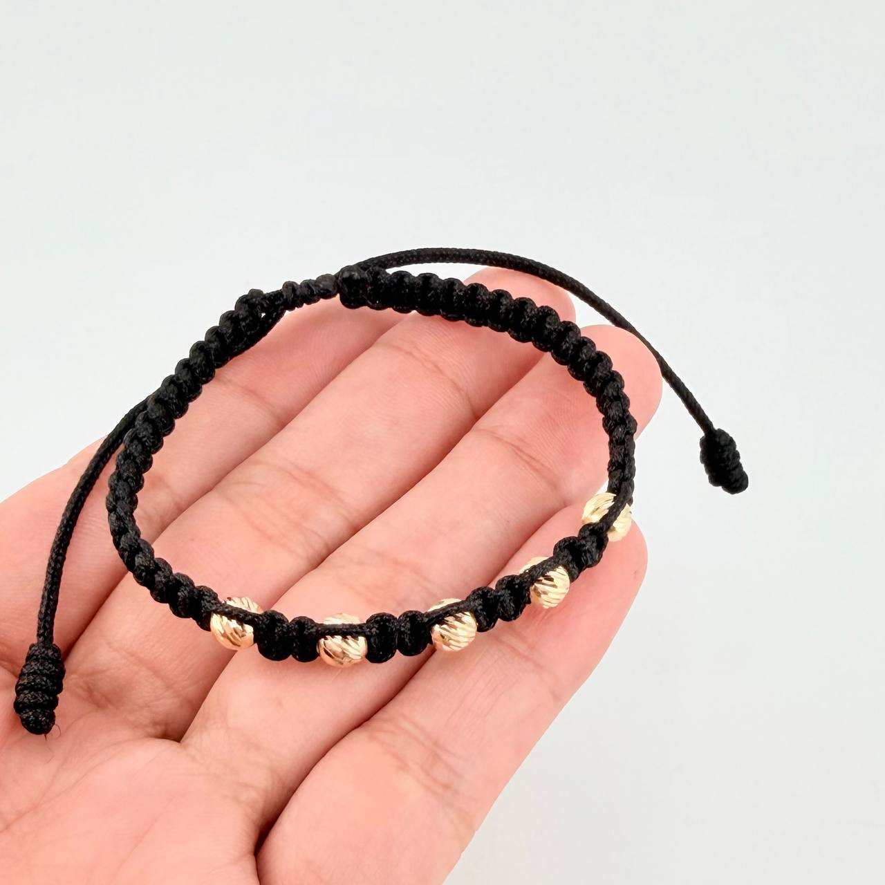 Pulsera Tejida Negra Bolas Diamantadas Oro Amarillo 18K
