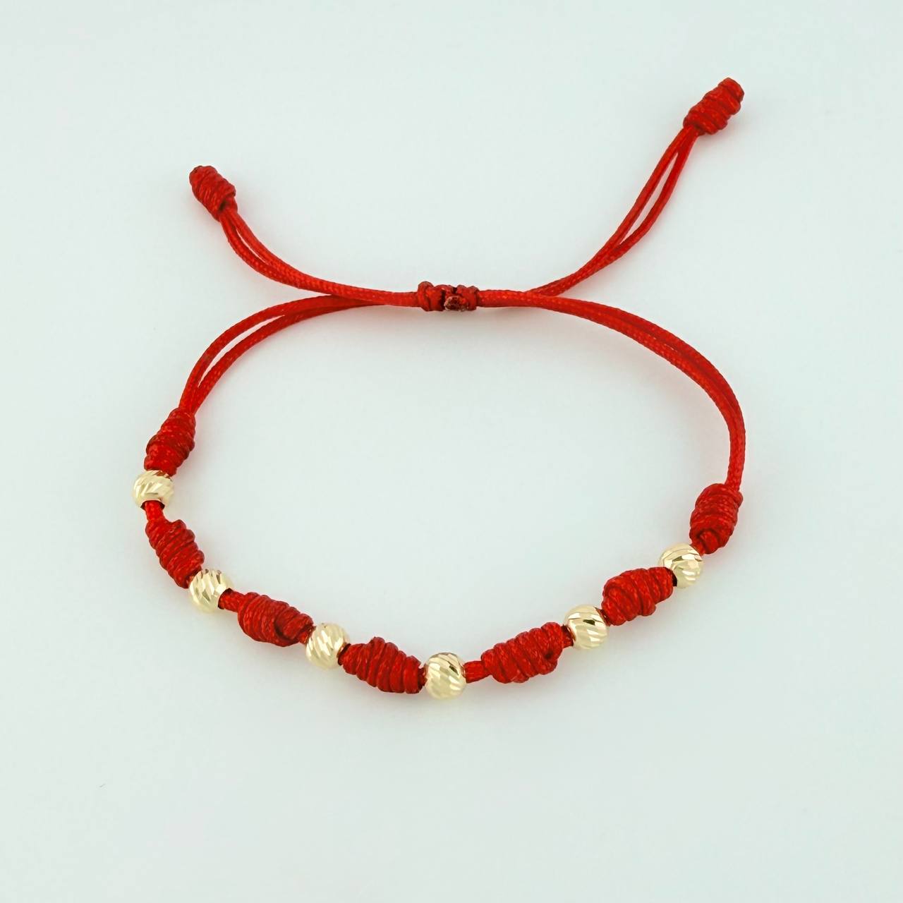 Pulsera Tejida Roja Siete Nudos Bolas Diamantadas Oro Amarillo 18K
