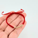 Pulsera Tejida Roja Bolas Lisas Oro Amarillo 18K