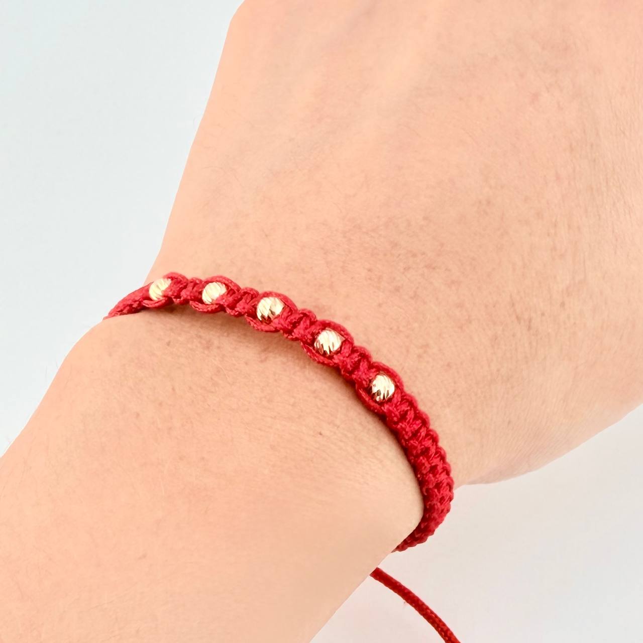 Red Woven Bracelet with Diamond Cut Beads in 18K Yellow Gold