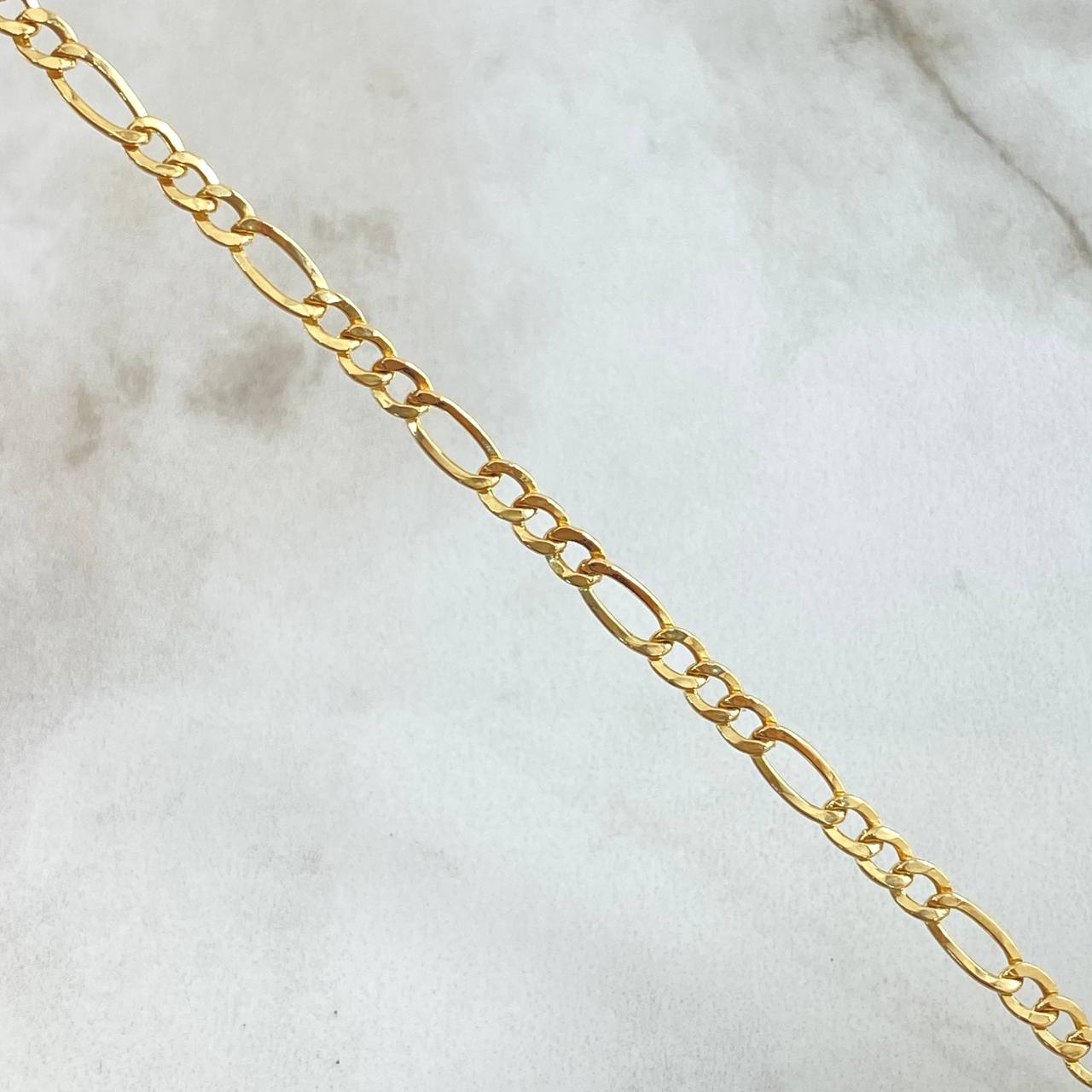 Pulso Figaro 1.65gr / 7 3/4 in / 3.4mm Oro Amarillo +1 18K