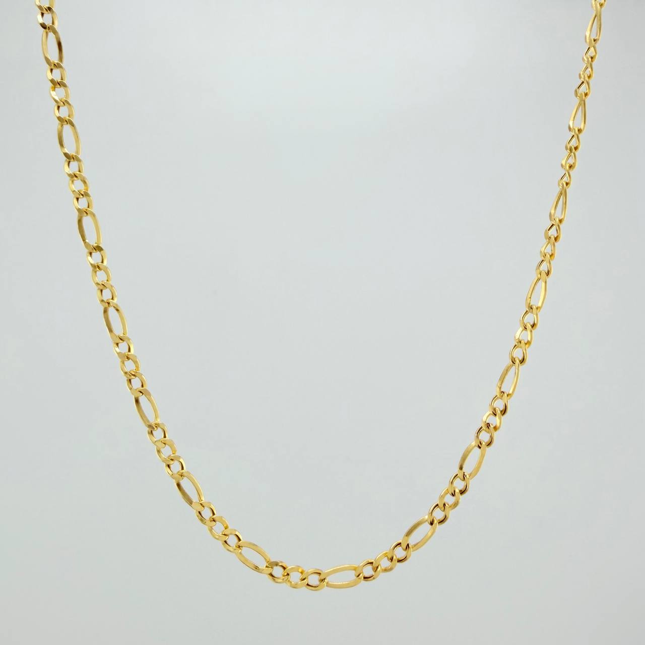 Cadena Figaro 3.05gr / 23 3/4 in / 2.38mm Oro Amarillo +1 18K $