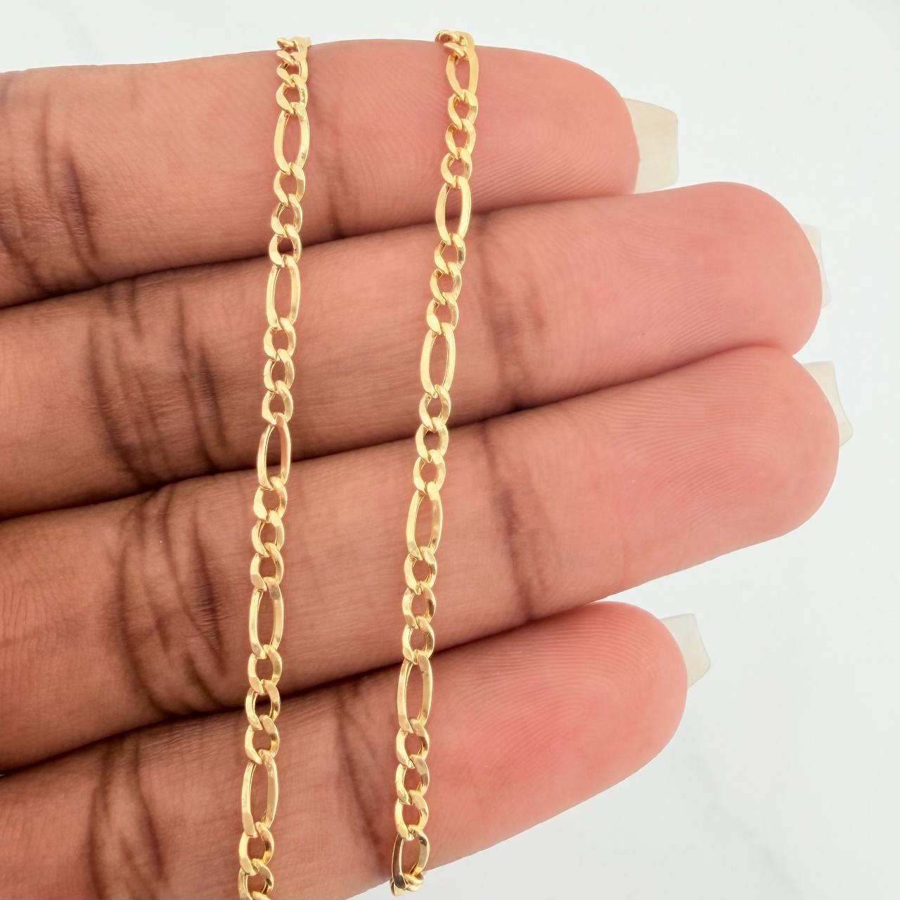 Cadena Figaro 3.05gr / 23 3/4 in / 2.38mm Oro Amarillo +1 18K $