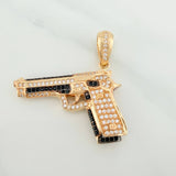 Dije Pistola 10.95gr / 1 1/2 in / Dos Oros Negro Amarillo 18K $