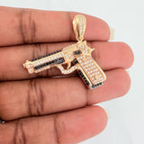 Dije Pistola 10.95gr / 1 1/2 in / Dos Oros Negro Amarillo 18K $