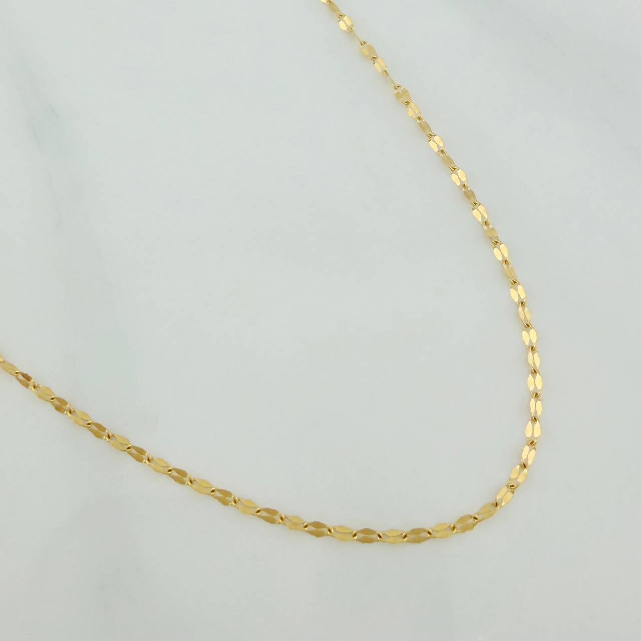 Cadena Flor Espejo 1.15gr / 23 3/4 in / 0.9mm Oro Amarillo +3 18K %