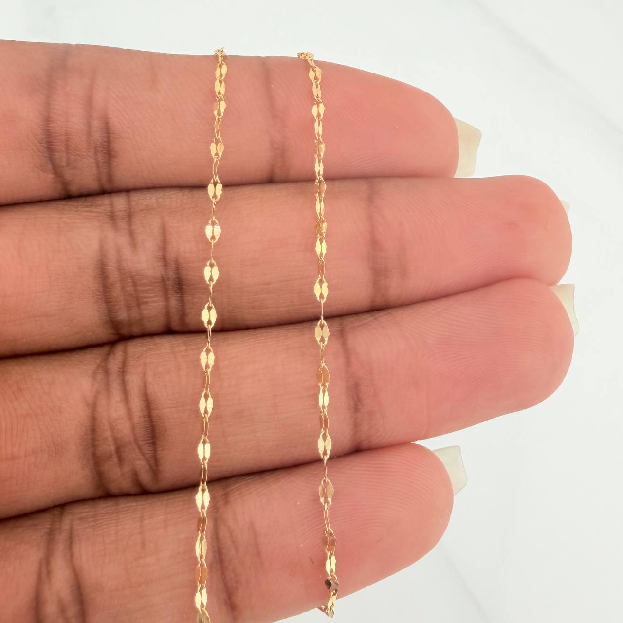 Cadena Flor Espejo 1.15gr / 23 3/4 in / 0.9mm Oro Amarillo +3 18K %