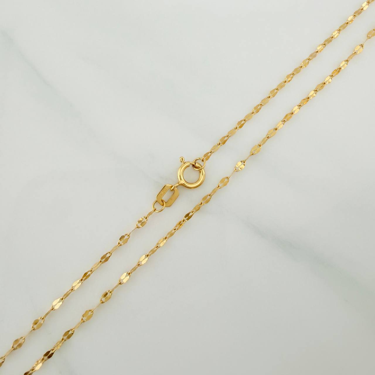 Cadena Flor Espejo 1.15gr / 23 3/4 in / 0.9mm Oro Amarillo +3 18K %