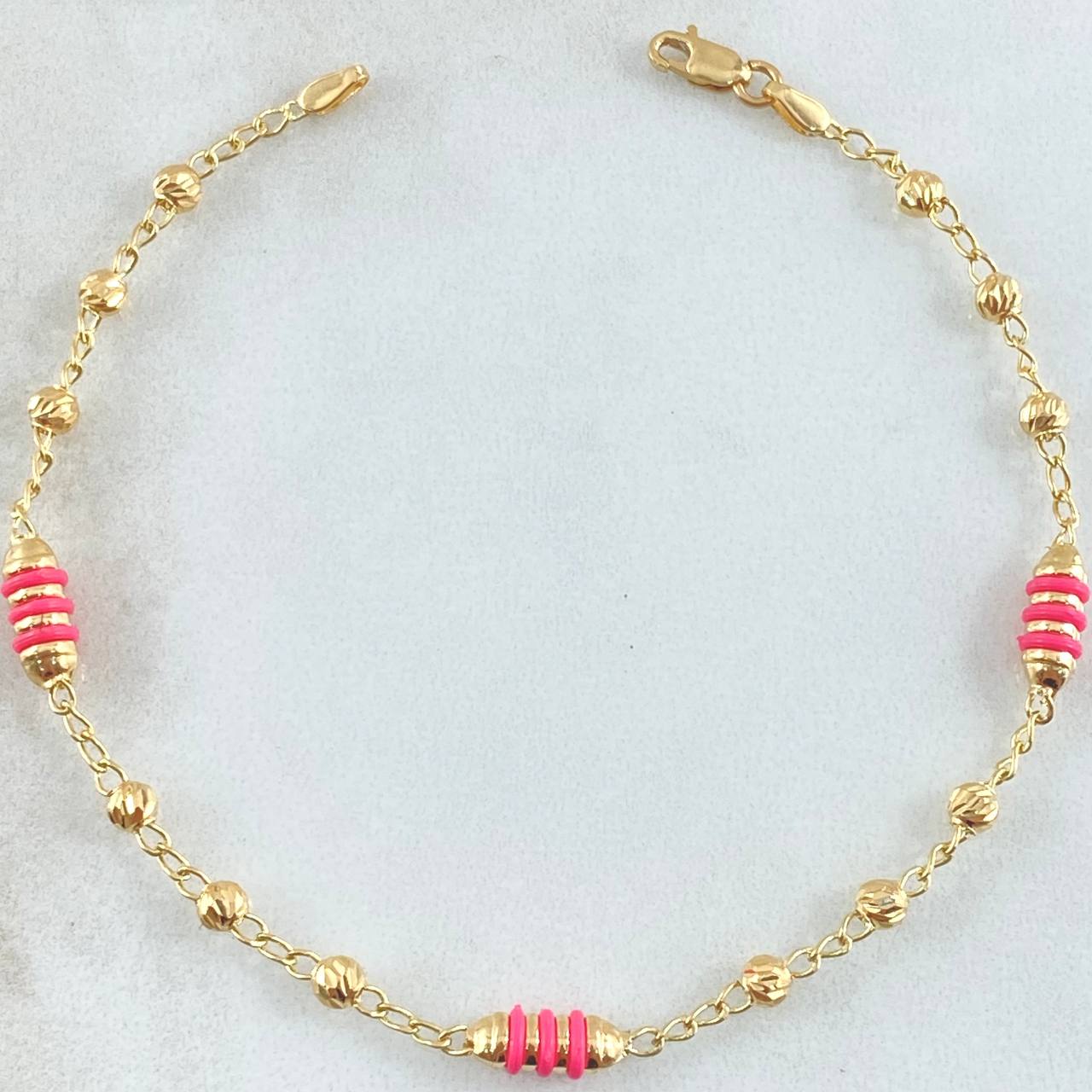 Pulso Espiga Tipo Militar 2.8gr / 18.5cm / 3mm Bolas Diamantadas Cauchos Fucsias Oro Amarillo 18K