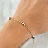 Pulso Espiga Bolas Emuladoras 2.55gr / 18.5cm / 3mm-4mm Diamantadas Cauchos Negros Oro Amarillo 18K