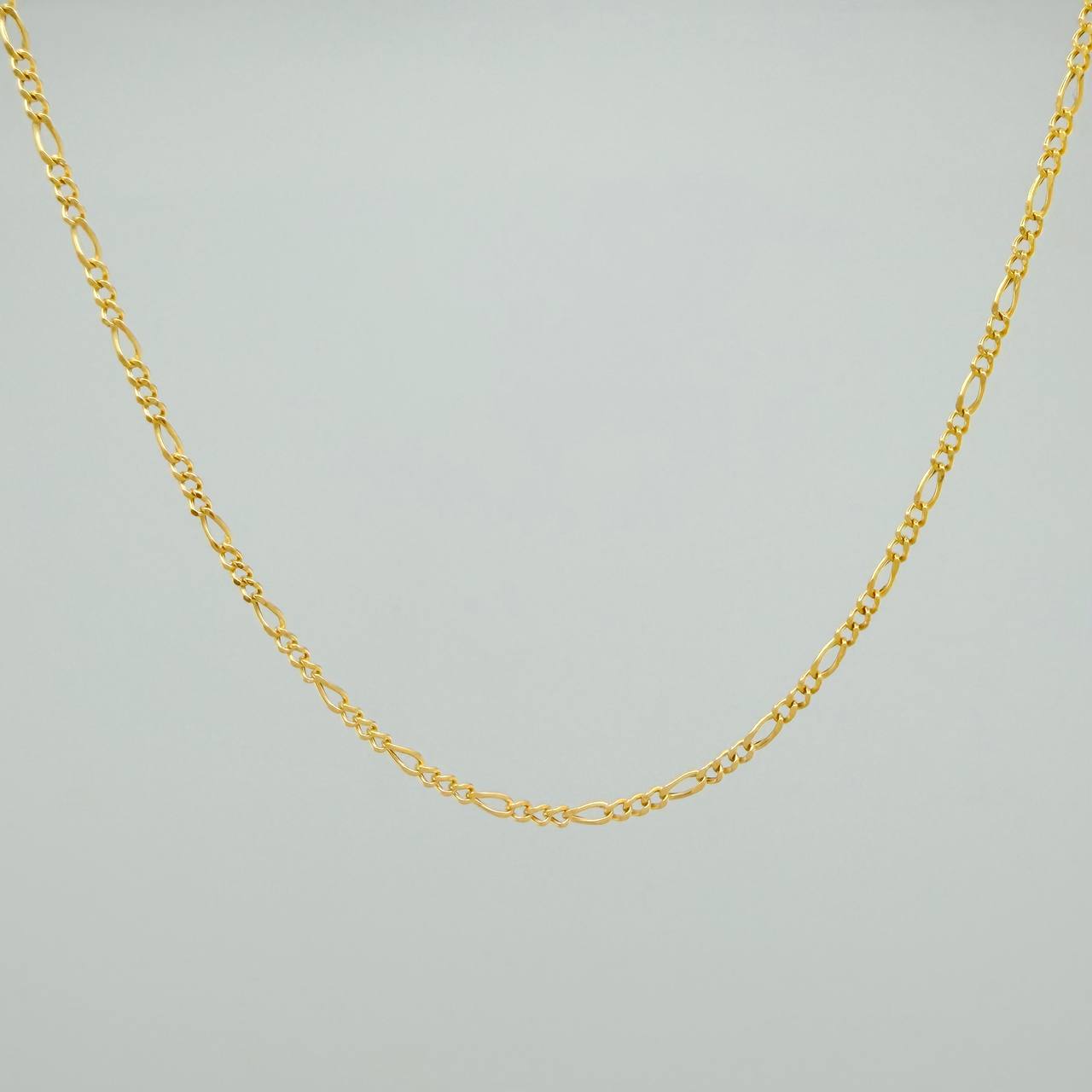 Cadena Figaro 1.35gr / 17 3/4 in / 1.1mm Oro Amarillo +1 18K %