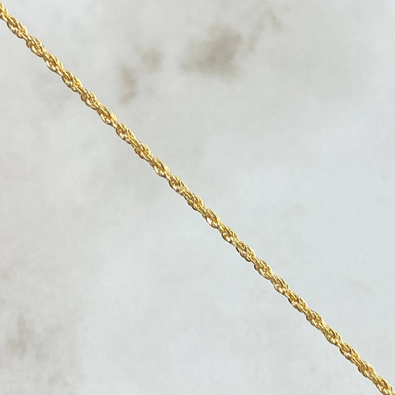 Set Rope Chain 1.2gr / 23.6in / 1.2mm + Pendant Money Bag 0.5gr / 1.5cm (0.6in) / 1.7gr 18K Yellow Gold (Offer) ©