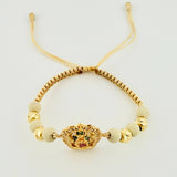 Pulsera Tejida Beige Virgen de Guadalupe Bolas Diamantadas Oro Amarillo 18K